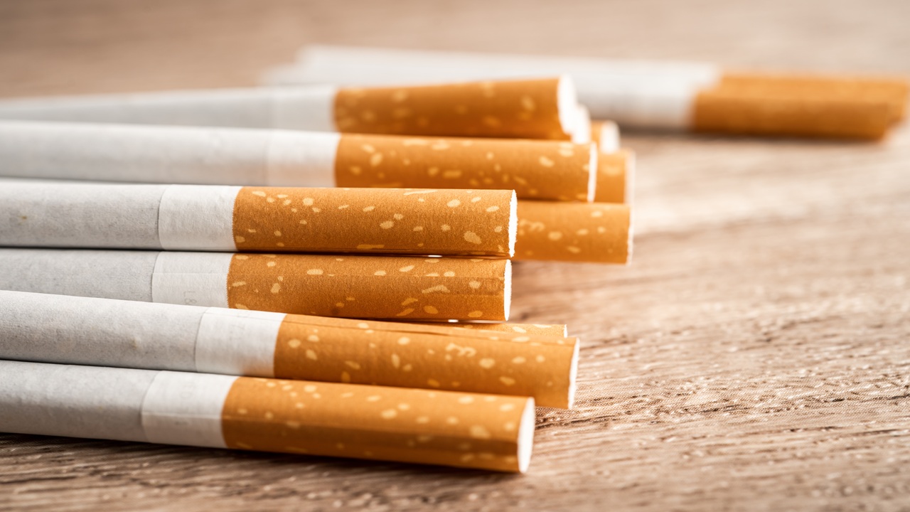 Cigarette, tobacco in roll paper with filter tube, No smoking co